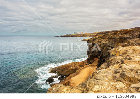 The rocky shore of the island Tenerife in Costa Adeje (Spain) The rocky shore of the island Tenerife in Costa Adeje (Spain) 115634998