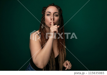 Woman With Dreadlocks Making Hush Gesture Woman With Dreadlocks Making Hush Gesture 115635065