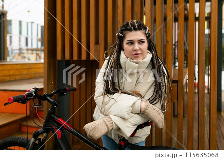 Woman With Dreadlocks Standing Next to Bike Woman With Dreadlocks Standing Next to Bike 115635068