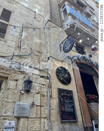 Street view of old town in Valletta, Malta, Europe. Christmas decorations on the streets  115635396