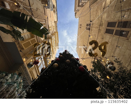 Street view of old town in Valletta, Malta, Europe. Christmas decorations on the streets Street view of old town in Valletta, Malta, Europe. Christmas decorations on the streets 115635402