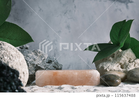 Background for cosmetic products grey concrete scene with himalayan salt and green leaves. Natural stone podium. Empty showcase for packaging product presentation. Mock up pedestal eco friendly 115637488