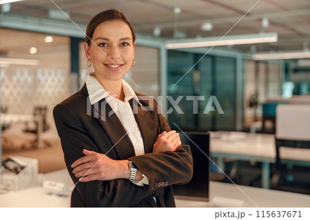 Portrait of a confident businesswoman in a modern office setting, exuding professionalism 115637671