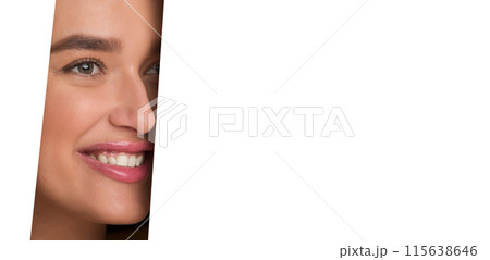 The image shows a woman face peeking through a perfectly circular hole in a white piece of paper. Her features are visible, framed by the edges of the hole. 115638646