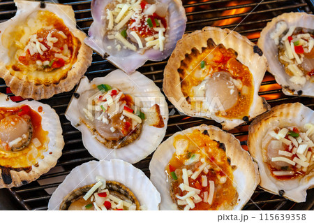 grilled scallops with cheese on the grill 115639358