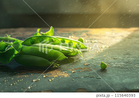 Young green peas in pods on a light background 115640393