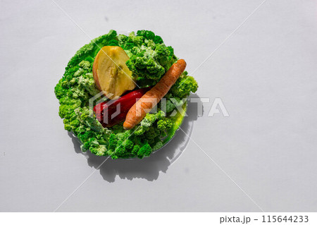 Carrot, apple and pepper on green mold and moss Carrot, apple and pepper on green mold and moss 115644233