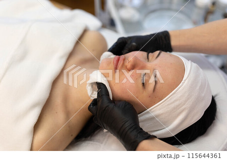 woman at the cosmetologist. She has problem skin and acne. woman at the cosmetologist. She has problem skin and acne. 115644361