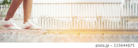 Banner Woman traveller walking on road relaxation. Women wear sneaker shoes walking summer park. Females standing green park on forest pathway outdoors. Traveler relaxing walk way with copy space Banner Woman traveller walking on road relaxation. Women wear sneaker shoes walking summer park. Females standing green park on forest pathway outdoors. Traveler relaxing walk way with copy space 115644875