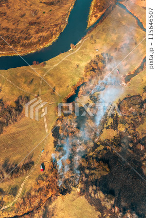 Nature In Danger. Wild Open Fire Destroys Grass. Natural Disaster. Aerial View Of Dry Grass Burns During Drought And Hot Weather. Concept Of Save Nature. Bush Fire And Smoke In Meadow Field 115646507