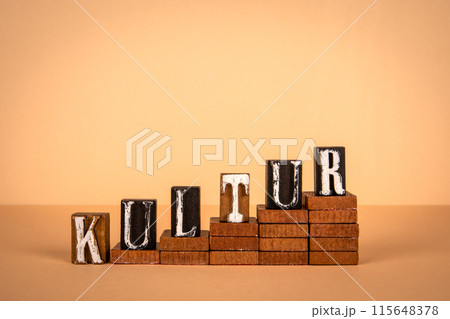 Culture word in German. Wooden alphabet letters on a light background 115648378