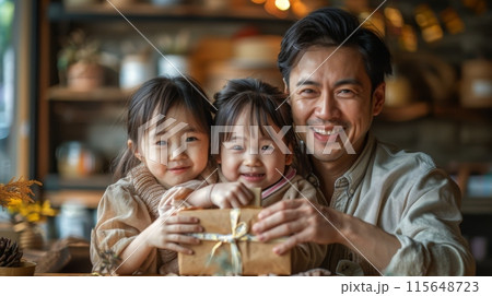 Father's Day. Children and partners prepare personalized gifts, heartfelt cards, and creative surprises to express their love and appreciation for their fathers. asian family 115648723