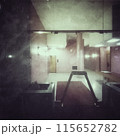 Entrance of an apartment building in Milan, seen from the public street through a glass door, in 2024. 115652782