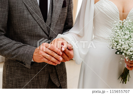 bride and groom, wedding celebration, wedding rings 115655707
