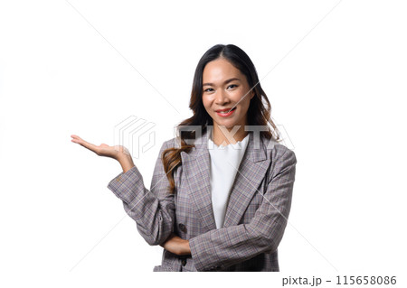Attractive businesswoman in suit pointing on free space isolated on white background 115658086
