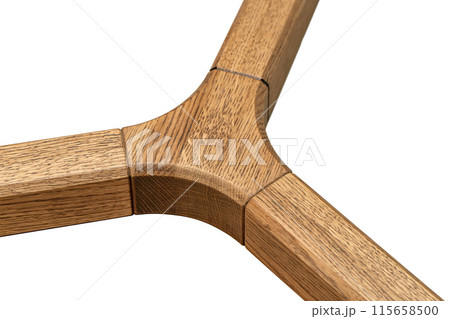 Triple jointed wooden frame of the table is made of solid oak on white background 115658500