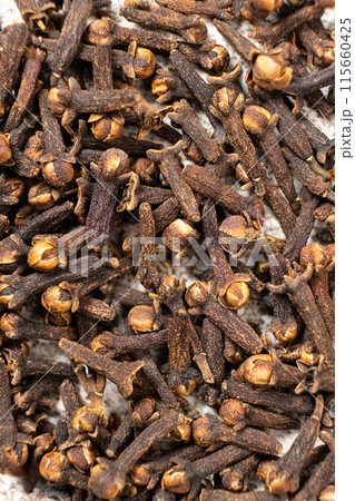 Dried clove spice, macro top view 115660425