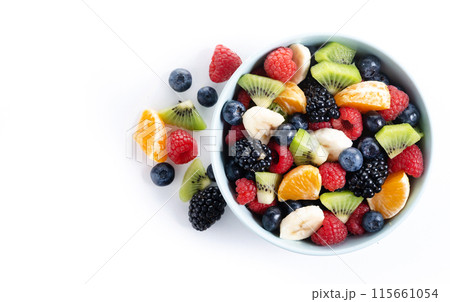 Fruit salad in a blue bowl isolated on white background 115661054