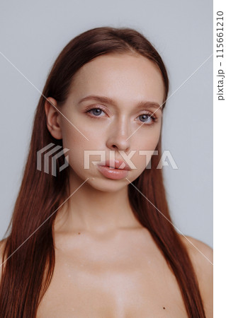 Healthy skin woman beauty hand manicure touching skin portrait natural make up 115661210