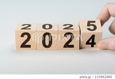 2025 happy new year, Flipping of wooden cube block change from 2024 to 2025. Wooden cube with flip over block 2024 to 2025 number. Business management, Inspiration to success ideas and goals. 115662860