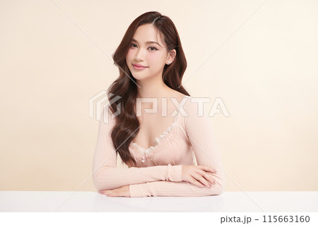 Beautiful young asian woman with clean fresh skin on beige background, Face care, Facial treatment, Cosmetology, beauty and spa, Asian women portrait. Beautiful young asian woman with clean fresh skin on beige background, Face care, Facial treatment, Cosmetology, beauty and spa, Asian women portrait. 115663160