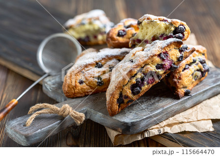 Homemade skones with berries on wooden board. Healthy vegan dessert concept. 115664470