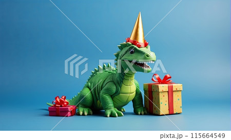 A green toy dinosaur in a birthday hat with gift box and red ribbon, blue background, copy space 115664549