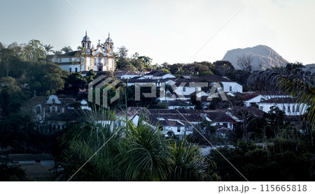 Tranquil Colonial Town Nestled in Lush Greenery at Dusk 115665818