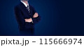 Businessman in a suit with arms crossed, standing against a dark background. Ideal for business, leadership, and professional concept 115666974