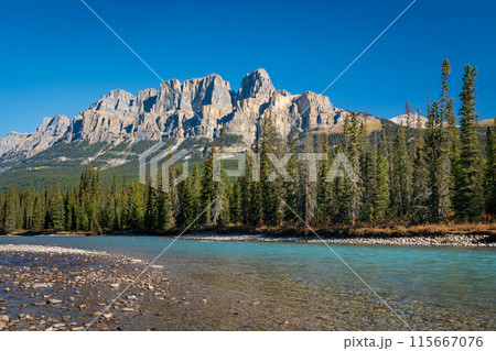 Castle Mountain and Bow River in summer sunny day. Castle Mountain viewpoint. Banff National Park, Canadian Rockies, Alberta, Canada. Castle Mountain and Bow River in summer sunny day. Castle Mountain viewpoint. Banff National Park, Canadian Rockies, Alberta, Canada. 115667076