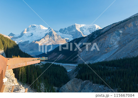Columbia Icefield Skywalk. Snow-covered Rocky Mountains in the background. Jasper National Park, Alberta, Canada. Columbia Icefield Skywalk. Snow-covered Rocky Mountains in the background. Jasper National Park, Alberta, Canada. 115667084
