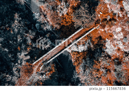 Aerial view of a stone medieval bridge over a rugged terrain. Akapnou village, Limassol District, Cyprus 115667836