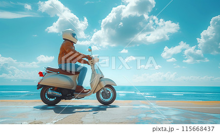 Man riding scooter on wet coastal road with ocean view and bright blue sky 115668437