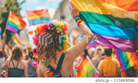 Crowd celebrating with rainbow flags at a public event Crowd celebrating with rainbow flags at a public event 115669096