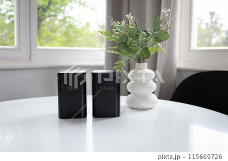 Tea and shugar containers on the table Tea and shugar containers on the table 115669726