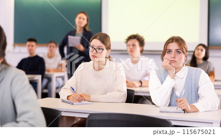 Young girls students study diligently at school Young girls students study diligently at school 115675021