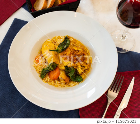 Traditional french cuisine, сhicken thigh curry with rice 115675023