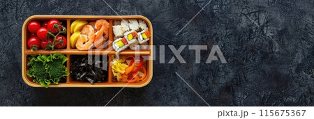 Wooden bento box with assorted sushi and sashimi. 115675367