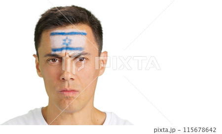 Serious man with a israeli flag painted on the face Serious man with a israeli flag painted on the face 115678642