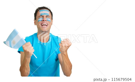 Man cheering for Argentina screaming and waving a national flag 115679504
