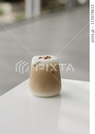 Elegant frothy iced coffee on white. Elegant frothy iced coffee on white. 115679613