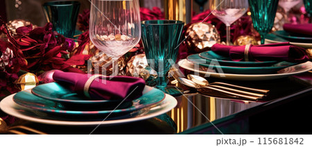 Christmas eve dinner party table setting with lights and gold glittering decorations 115681842