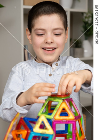 Happy carefree child playing with toys 115685199