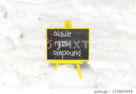 VOC volatile organic compound symbol. Concept words VOC volatile organic compound on beautiful yellow blackboard. Beautiful snow background. Business VOC volatile organic compound concept. Copy space 115685949