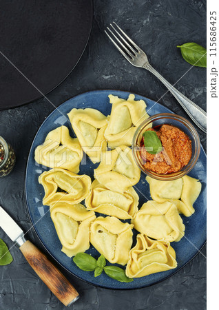 Tortelloni stuffed with vegetables. 115686425