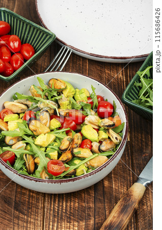 Salad with mussels. 115686426