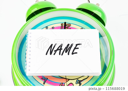 NAME word on a business card on the watch face 115688019