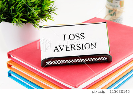Business concept. The inscription Loss Aversion on the card on the stand Business concept. The inscription Loss Aversion on the card on the stand 115688146