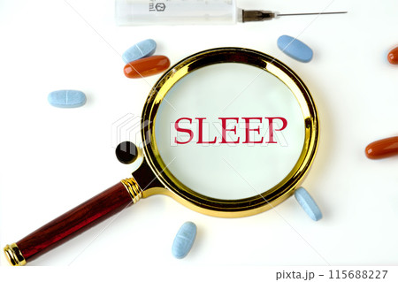 Copy space. Healthy lifestyle and sleep well concept. SLEEP text through a magnifying glass on a white background Copy space. Healthy lifestyle and sleep well concept. SLEEP text through a magnifying glass on a white background 115688227