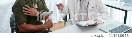 Soldier Having Consultation With Doctor Soldier Having Consultation With Doctor 115688628